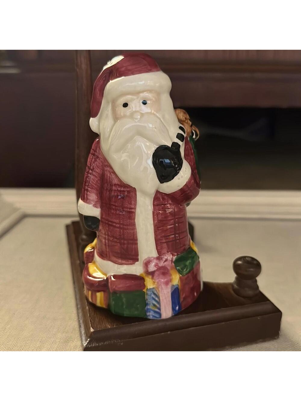 Vintage Sakura Santa Claus porcelain figurine with toy sack and presents.
